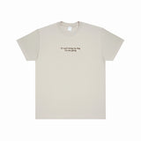 Beige t-shirt with text on a white background