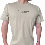 Beige t-shirt with text 'If I can't bring my dog, I'm not going' on a white background